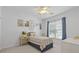 Cozy bedroom featuring a twin bed, colorful artwork, and a bright window view at 6360 Waveland Dr, Cumming, GA 30040