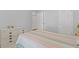 Bedroom showcasing a neutral color scheme, large bed, and ample closet space at 6360 Waveland Dr, Cumming, GA 30040