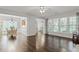 Expansive living area with hardwood floors, ample natural light, and an open layout at 6360 Waveland Dr, Cumming, GA 30040