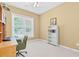Bright office with a computer desk, shelving, and large window with natural light at 6360 Waveland Dr, Cumming, GA 30040