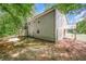 Expansive backyard bordered by lush trees, offering a private and serene outdoor space at 10 Canyon Cove Cv, Ellenwood, GA 30294