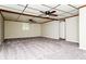 Spacious finished basement with tiled ceiling and recessed lighting at 10 Canyon Cove Cv, Ellenwood, GA 30294