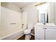 Neat bathroom with a bathtub, toilet, and sink vanity, providing a functional and comfortable space at 10 Canyon Cove Cv, Ellenwood, GA 30294