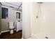 Full bathroom features vinyl floor, shower stall and toilet, along with vanity sink at 10 Canyon Cove Cv, Ellenwood, GA 30294