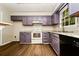 Updated kitchen with ample countertop space and modern appliances at 10 Canyon Cove Cv, Ellenwood, GA 30294
