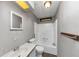 Bathroom featuring a shower-tub combo, vanity sink, toilet, and wood-look flooring at 2017 S Deshon Rd, Lithonia, GA 30058