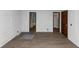 A bare bedroom features new laminate flooring and light walls at 2017 S Deshon Rd, Lithonia, GA 30058