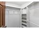 Walk-in closet featuring wood and wire shelving for optimal storage space at 2017 S Deshon Rd, Lithonia, GA 30058