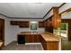 The kitchen has wood cabinets, butcher block countertops, and stainless-steel appliances at 2017 S Deshon Rd, Lithonia, GA 30058