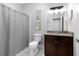 Neutral bathroom with granite countertop, tile floors and shower-tub combo at 3280 Stillhouse Se Ln # 410, Atlanta, GA 30339