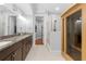 Bathroom featuring double vanity, a walk-in glass shower and a luxurious wooden sauna at 3280 Stillhouse Se Ln # 410, Atlanta, GA 30339
