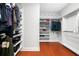Organized walk-in closet with custom shelving and ample storage, ensuring optimal organization at 3280 Stillhouse Se Ln # 410, Atlanta, GA 30339