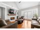Bright and open living room featuring fireplace, hardwood floors, and natural light at 3280 Stillhouse Se Ln # 410, Atlanta, GA 30339