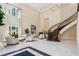 Spacious living room with staircase, fireplace and lots of natural light at 3280 Stillhouse Se Ln # 410, Atlanta, GA 30339