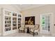 Bright sitting room with built-in bookshelves, light marble floors, and high ceilings at 3280 Stillhouse Se Ln # 410, Atlanta, GA 30339