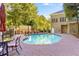 Relaxing pool area with ample seating surrounded by mature trees at 3280 Stillhouse Se Ln # 410, Atlanta, GA 30339