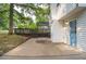 Backyard features a spacious deck, cement patio, and lush landscaping at 4510 Virginia Nw Ave, Kennesaw, GA 30144
