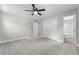 This spacious bedroom has plush carpet, a closet, and access to an updated bathroom at 4510 Virginia Nw Ave, Kennesaw, GA 30144