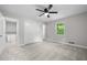 This bedroom includes a ceiling fan and large closet with a peek into the en-suite bathroom at 4510 Virginia Nw Ave, Kennesaw, GA 30144