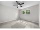 Bedroom featuring new carpet, a ceiling fan, and a bright, leafy view window at 4510 Virginia Nw Ave, Kennesaw, GA 30144