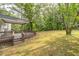 Spacious wooden deck with stairs overlooks the expansive yard at 4510 Virginia Nw Ave, Kennesaw, GA 30144