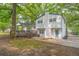 Home's backyard shows a wooden deck and expansive lush lawn at 4510 Virginia Nw Ave, Kennesaw, GA 30144