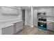 Renovated kitchen with stainless steel appliances and gray cabinets at 4510 Virginia Nw Ave, Kennesaw, GA 30144