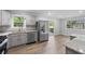 Bright kitchen featuring stainless steel appliances, granite countertops, and modern cabinets with ample natural light at 4510 Virginia Nw Ave, Kennesaw, GA 30144