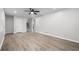 Bright living room features new laminate floors, ceiling fan and stairs to the second floor at 4510 Virginia Nw Ave, Kennesaw, GA 30144