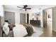Bedroom with hardwood floors, a ceiling fan, and walk-in closets at 26 Ivy Ne Pkwy, Atlanta, GA 30342
