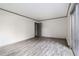 Empty bedroom with plank floors and a sliding glass door to the outdoors at 26 Ivy Ne Pkwy, Atlanta, GA 30342