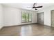 Bright bedroom with hardwood floors, a ceiling fan, and neutral walls at 26 Ivy Ne Pkwy, Atlanta, GA 30342