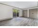 Bedroom with plank floors, walk-in closet, and a sliding glass door to the outdoors at 26 Ivy Ne Pkwy, Atlanta, GA 30342