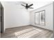 Well-lit bedroom with wood-look floors and a large window, offering a simple and clean space at 26 Ivy Ne Pkwy, Atlanta, GA 30342