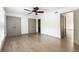 Bedroom featuring hardwood floors, a ceiling fan, and a walk-in closet at 26 Ivy Ne Pkwy, Atlanta, GA 30342