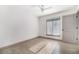 Bright bedroom with hardwood floors, neutral walls, and a window for natural light at 26 Ivy Ne Pkwy, Atlanta, GA 30342