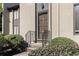 Close-up of a front entrance with well-maintained landscaping and a welcoming exterior light fixture at 26 Ivy Ne Pkwy, Atlanta, GA 30342