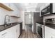 Kitchen featuring stainless steel appliances, white cabinets and contrasting countertops at 26 Ivy Ne Pkwy, Atlanta, GA 30342