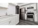 Updated kitchen featuring stainless steel appliances, white cabinets and a sink at 26 Ivy Ne Pkwy, Atlanta, GA 30342