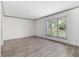 Bright, open living room with large windows and wood-look flooring, offering a clean and spacious feel at 26 Ivy Ne Pkwy, Atlanta, GA 30342