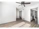 Bright living room featuring wood-look floors, ceiling fan, and fresh paint creates an inviting atmosphere at 26 Ivy Ne Pkwy, Atlanta, GA 30342