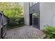 A brick patio with a wooden fence and access to the home through a glass sliding door at 26 Ivy Ne Pkwy, Atlanta, GA 30342