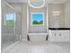 Stylish bathroom featuring soaking tub, glass shower, modern vanity, and an elegant chandelier at 301 Eminence Peak, Rydal, GA 30171