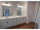 Bathroom with double sink vanity, contemporary fixtures, and large mirror at 3230 Cyrus Creek Dr, Kennesaw, GA 30152