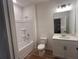 Bathroom features a shower-tub combo, white vanity, and modern fixtures, blending style and functionality at 3230 Cyrus Creek Dr, Kennesaw, GA 30152