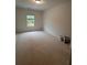A bright room with a window offers a blank canvas for creating your ideal bedroom retreat at 3230 Cyrus Creek Dr, Kennesaw, GA 30152