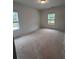 Bedroom with natural light from two windows at 3230 Cyrus Creek Dr, Kennesaw, GA 30152