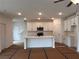 Bright, modern kitchen with white cabinets, stainless steel appliances, and center island at 3230 Cyrus Creek Dr, Kennesaw, GA 30152