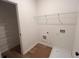 Functional laundry room boasts wire shelving, offering convenience and organization for laundry tasks at 3230 Cyrus Creek Dr, Kennesaw, GA 30152
