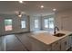 Spacious living room featuring an open floor plan, large windows, and modern finishes at 3230 Cyrus Creek Dr, Kennesaw, GA 30152